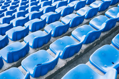 Empty blue colored stadium seats