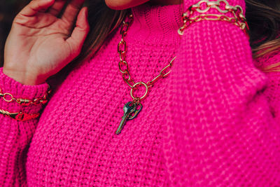Close-up of woman hand with pink hair