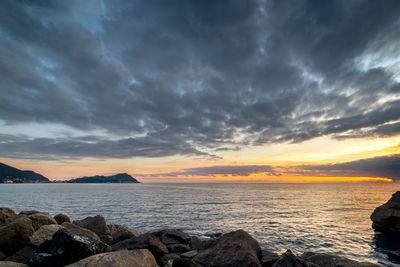 Scenic view of sea against sky during sunset