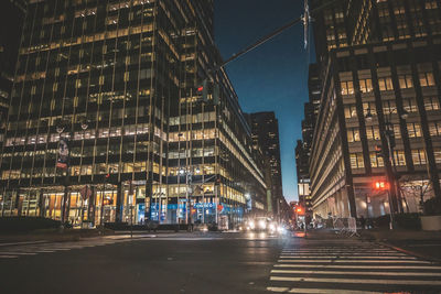 Illuminated buildings in city at night