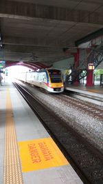 Train at railroad station at night