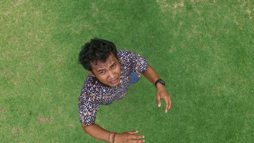 High angle view of girl standing on field