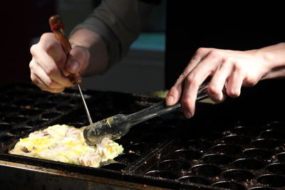 Close-up of person preparing food