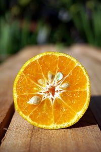 Close-up of orange slice on table