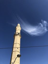 Low angle view of smoke stack against sky