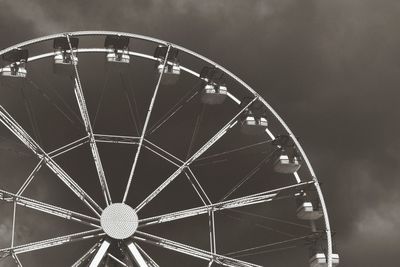 Low angle view of ferris wheel against sky