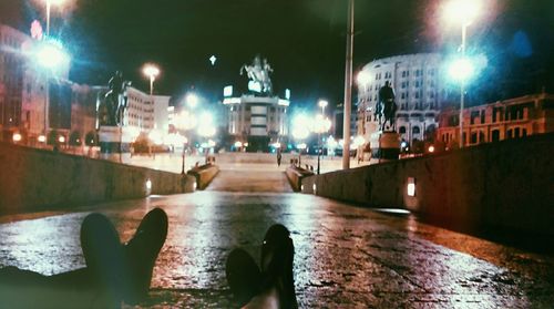 Illuminated road in city at night