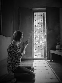 Woman praying at home at home
