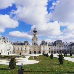 Palace against cloudy sky