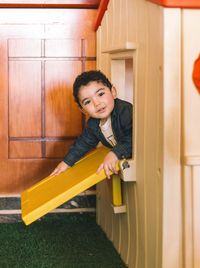 Portrait of smiling boy playing in playground