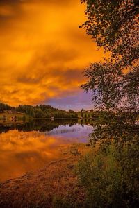 Scenic view of lake at sunset