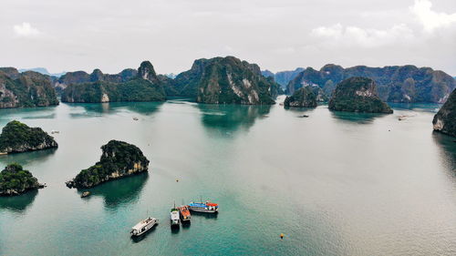 Panoramic view of boats in sea against sky