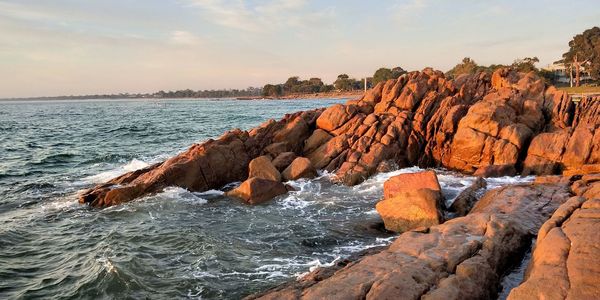 Scenic view of sea against sky at sunset