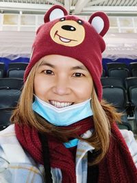 Portrait of young woman in warm clothing