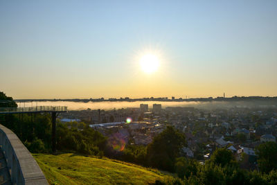 Scenic view of cityscape against sky during sunset