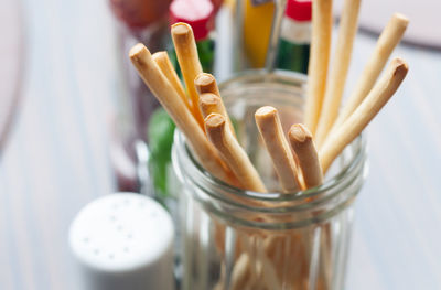 High angle view of pencils in jar on table