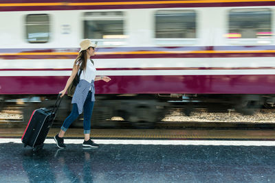 Rear view of woman in train