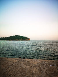 Scenic view of sea against clear sky