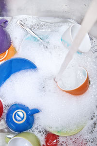 Close-up high angle view of dishes in kitchen sink