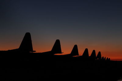 Silhouette of building during sunset