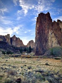 Rock formations on landscape against sky