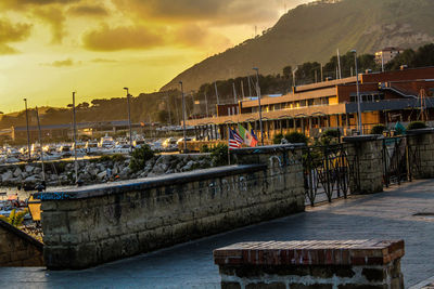 Boats in river at sunset