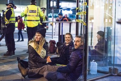 Group of people sitting in glass window