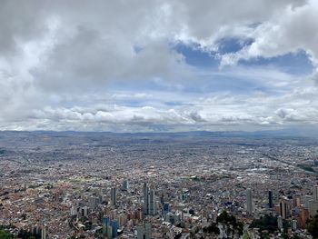 High angle view of city buildings against sky