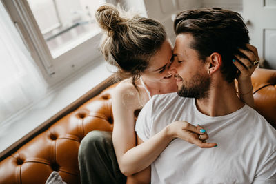 Young couple sitting at home