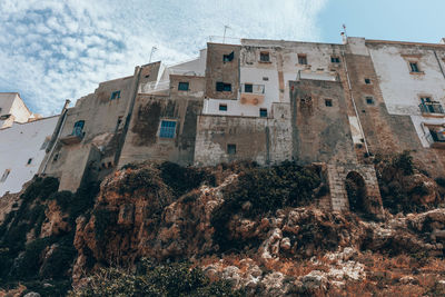 Low angle view of old buildings against sky