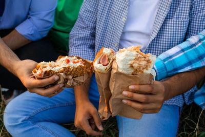 Midsection of man holding ice cream