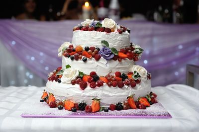 Close-up of cake on table during wedding
