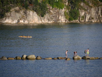 Men fishing in sea