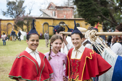 Portrait of people standing outdoors