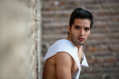 Portrait of young man standing outdoors