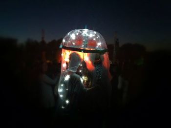 Close-up of woman at night