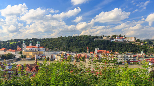 Houses in town against sky