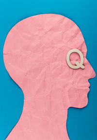 High angle view of paper against blue background