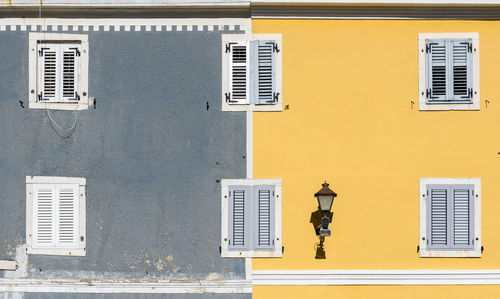 Colorful houses, minimalism, minimalist, architecture, yellow, grey, windows, symmetry.