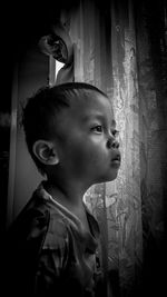 Portrait of cute boy looking away