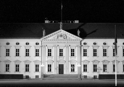 Facade of building against sky at night