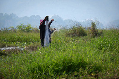 Woman standing on field