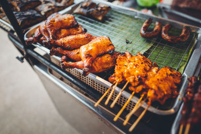 High angle view of meat on barbecue grill