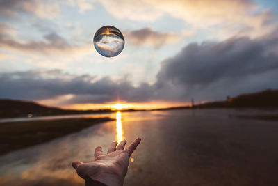 Hand throwing transparent ball