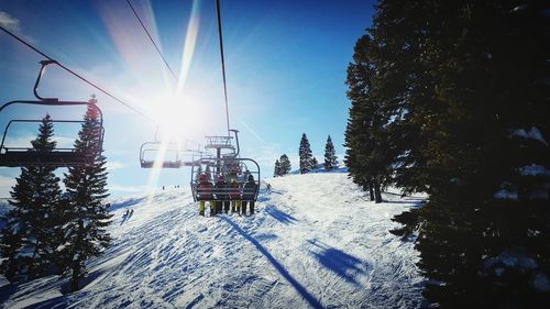 Ski lift against clear sky during winter