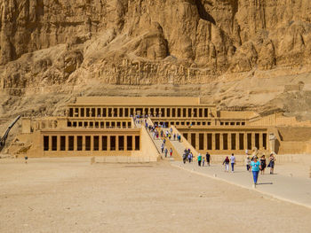 Group of people in front of built structure