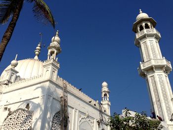 Low angle view of church against blue sky