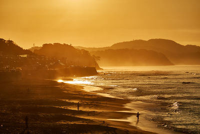 Scenic view of sea against sky during sunrise