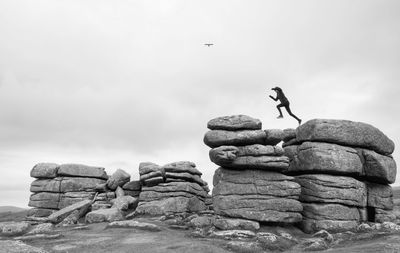 Low angle view of stack of rocks against sky