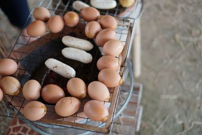 High angle view of eggs on barbecue grill